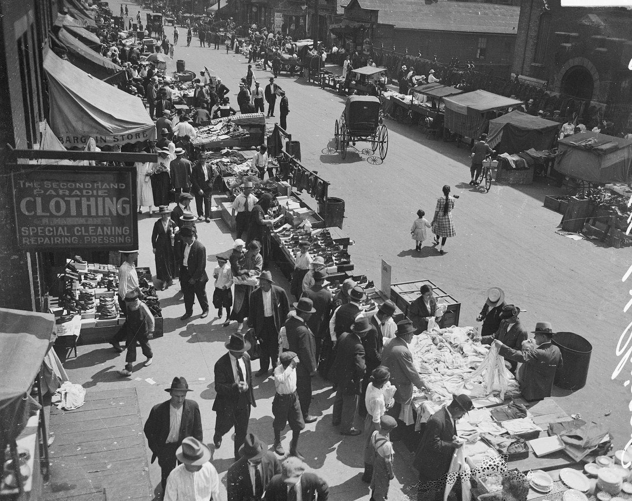 Merchants and shoppers along Maxwell Street at the Sunday market in the Chicago Jewish community located in the Near West Side community area, Chicago, Illinois, 1917.