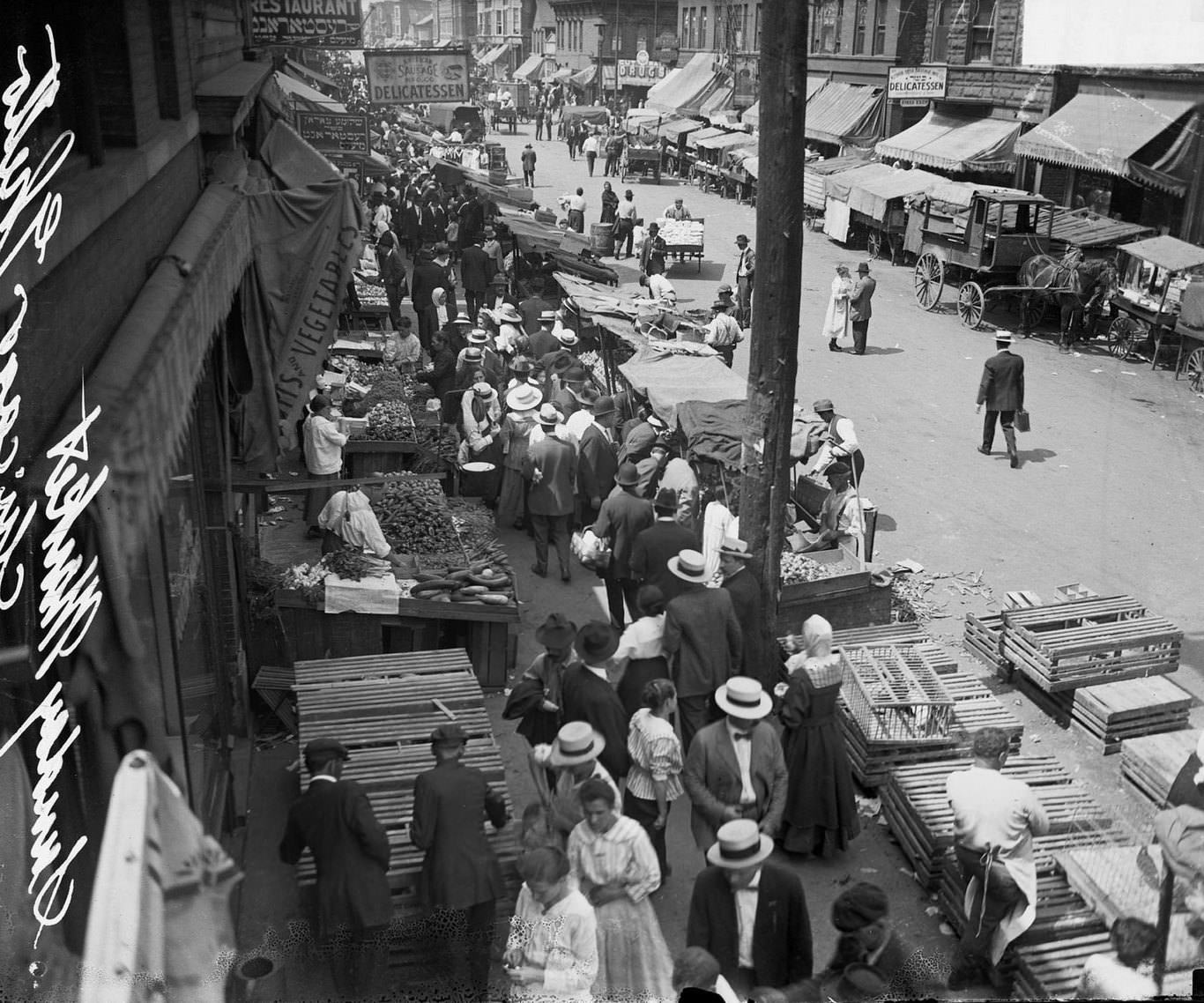Merchants and shoppers gathering along Maxwell Street, Chicago, Illinois, 1917.