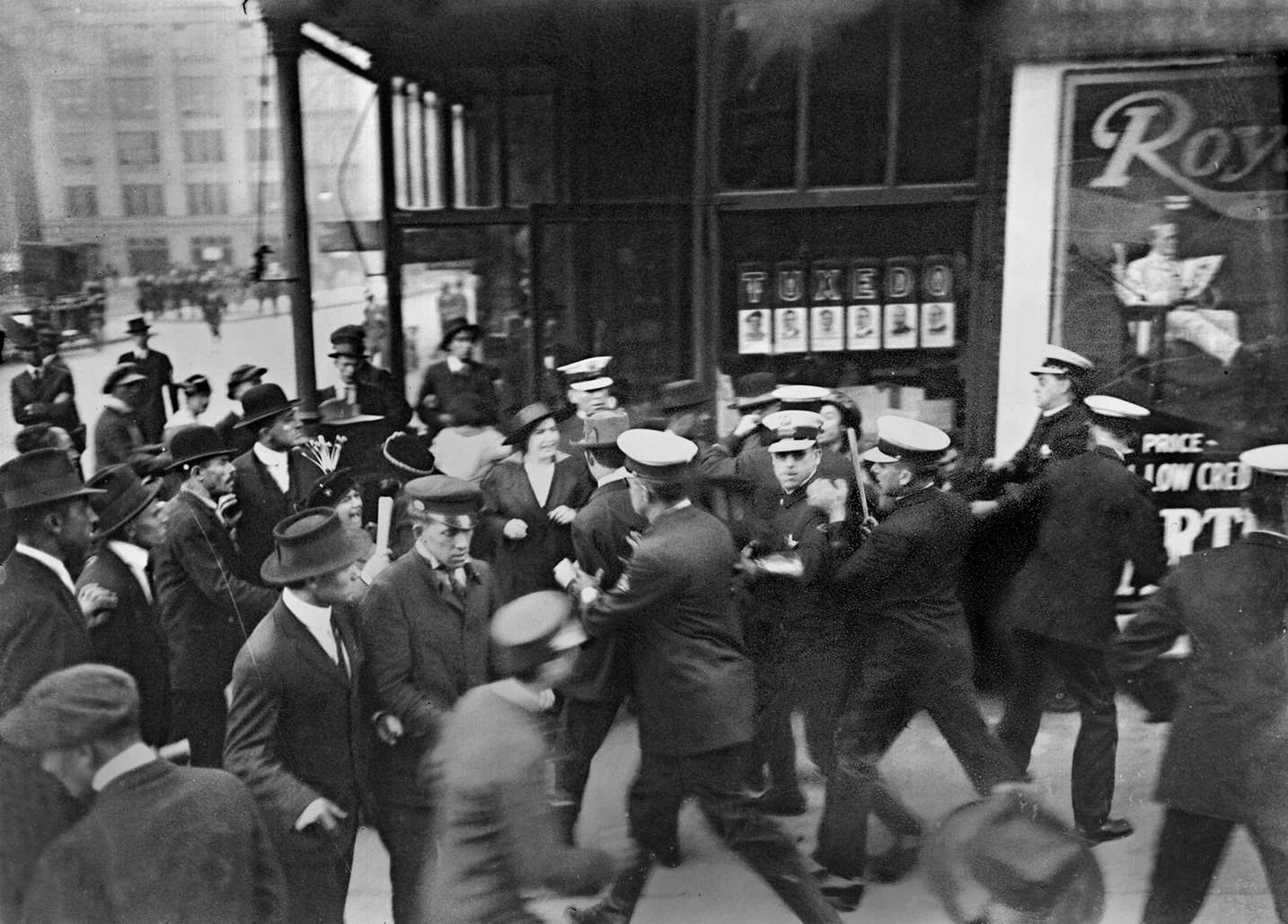 Striking garment workers and policemen scuffle in Chicago, Illinois, 1915.