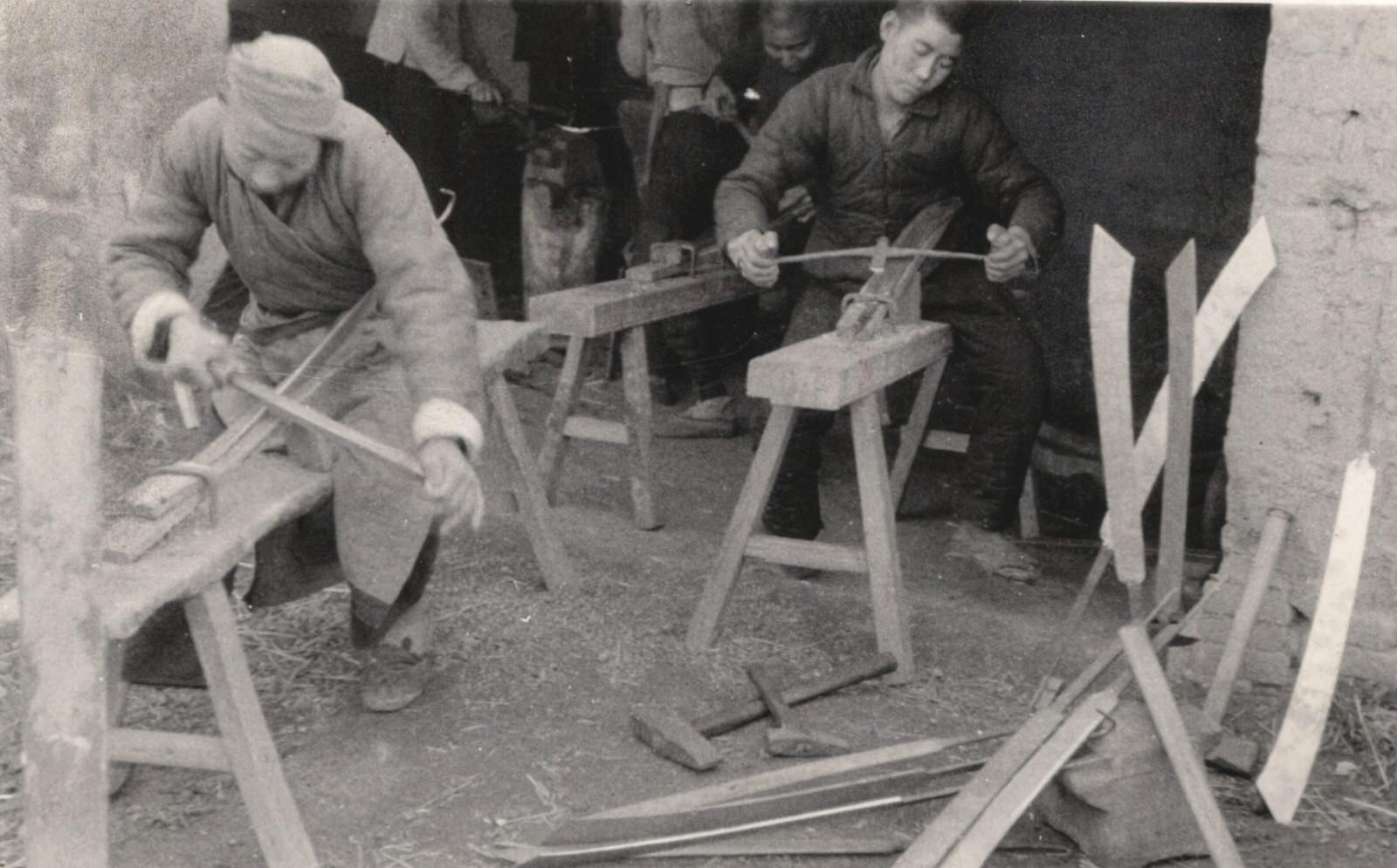 Railway workers on the Peking-Hankow (Beijing-Hankou) railway tore up steel railways and girders and made big swords for the guerrillas and the army from them. 1937-1940