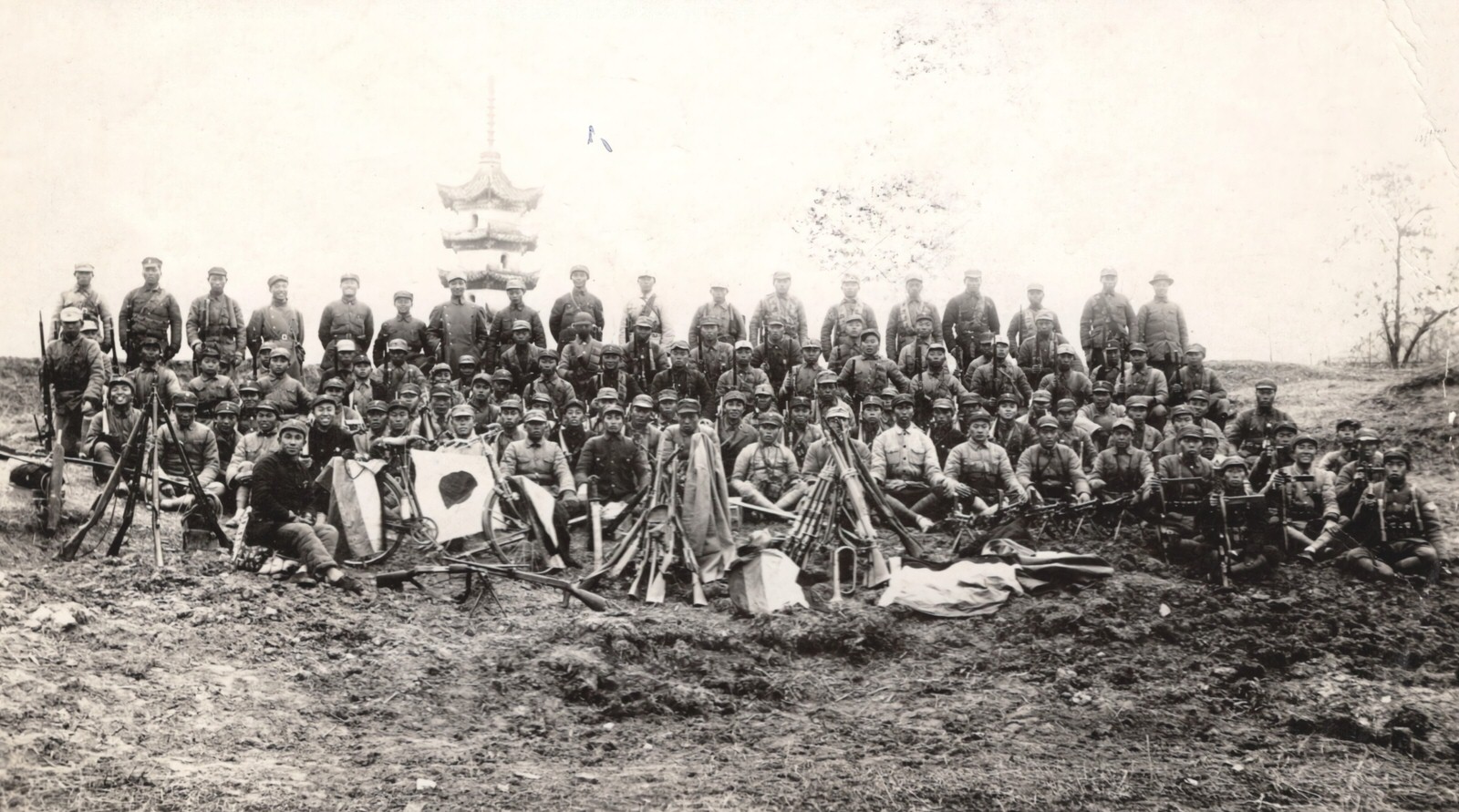 Communist-led New Fourth Army after a raid made by this detachment on a Japanese air-drome. Note the trophies of guns, bicycles, flags and coats. 1937-1940