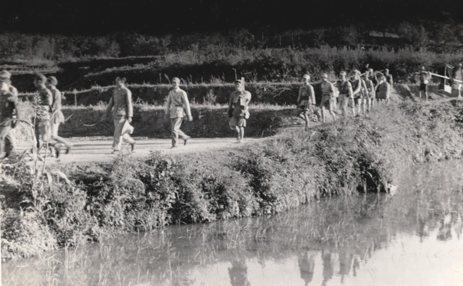 Armed soldiers marching. 1937-1940