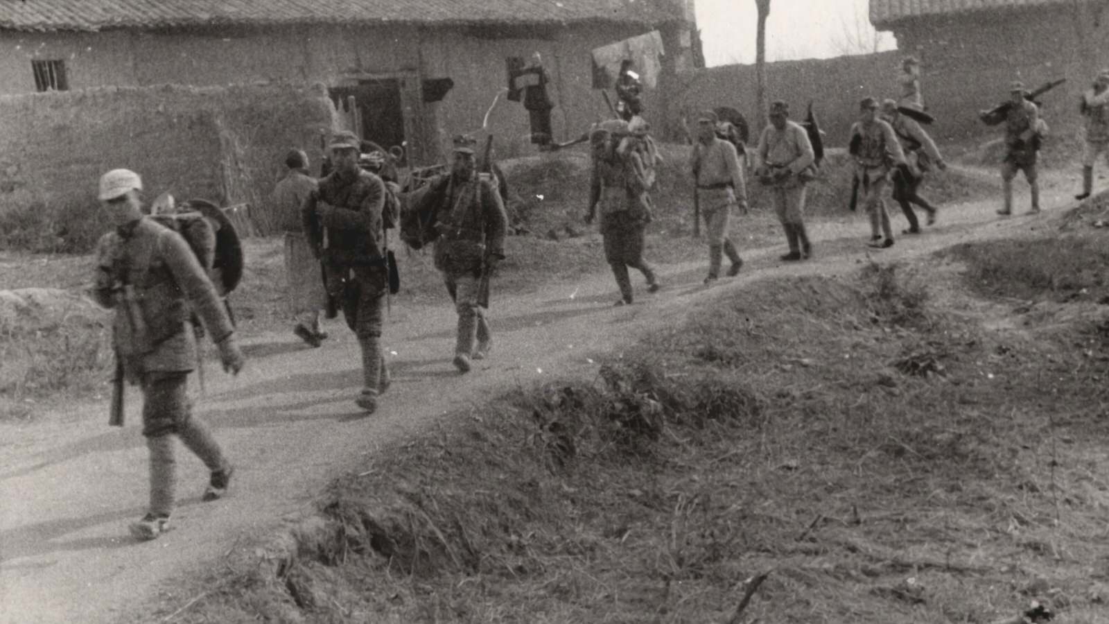 Armed soldiers marching. 1937-1940