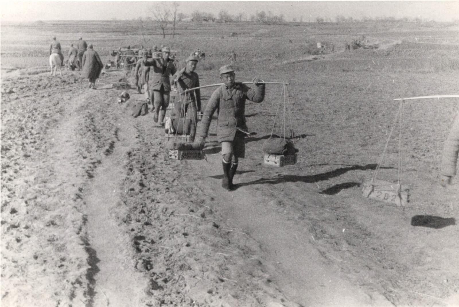 The paths of Central China are filled with men and animals carrying ammunition up to the front. 1937-1940