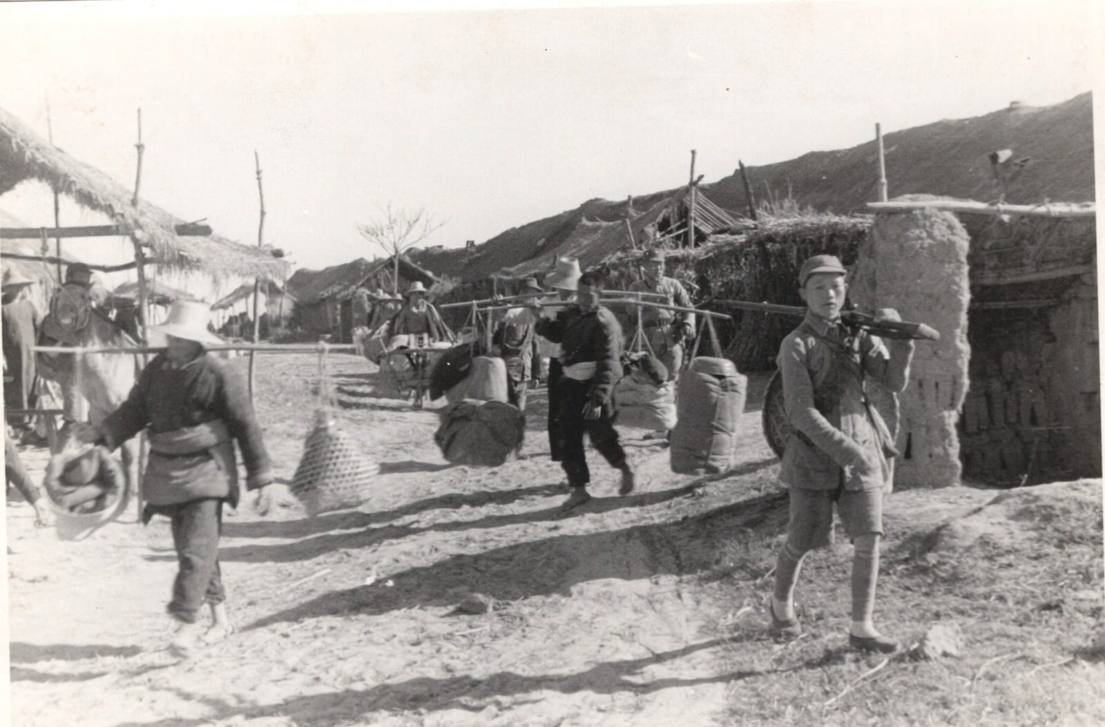 The paths of Central China are filled with men and animals carrying ammunition up to the front. 1937-1940