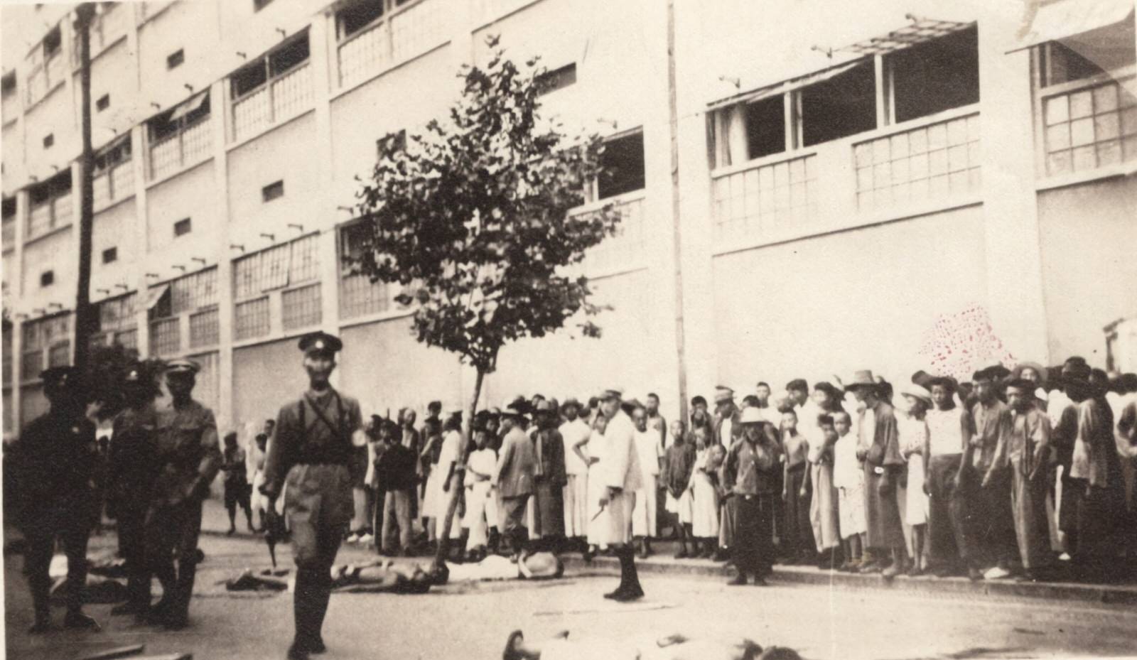 Unidentified group of civilians with army officers in foreground. 1937-1940