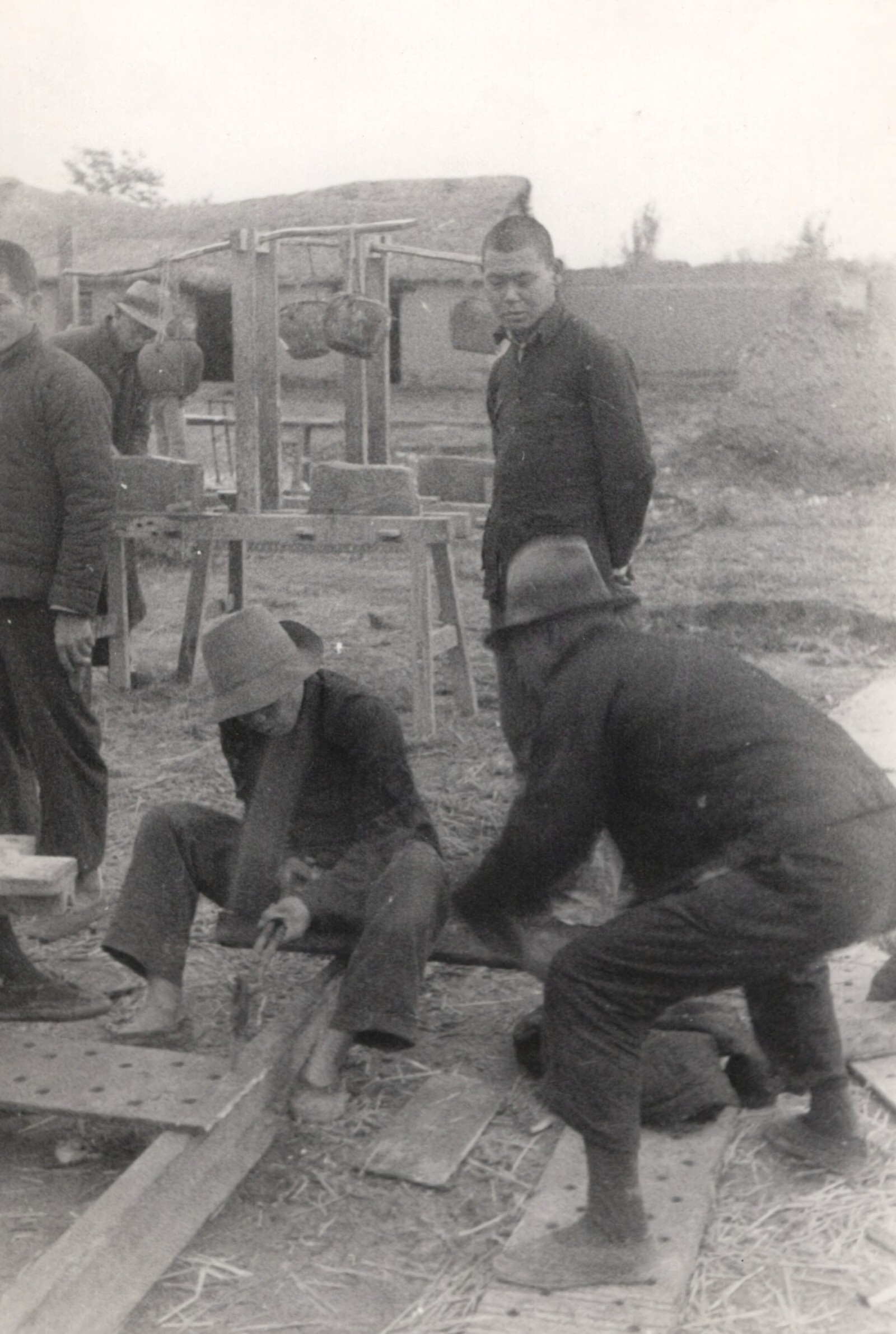 The railway workers of the destroyed town of Chumatien (Zhumadian) in Honan (Henan) took the steel rails and spans and beat them into big swords for the armies of liberation. 1937-1940