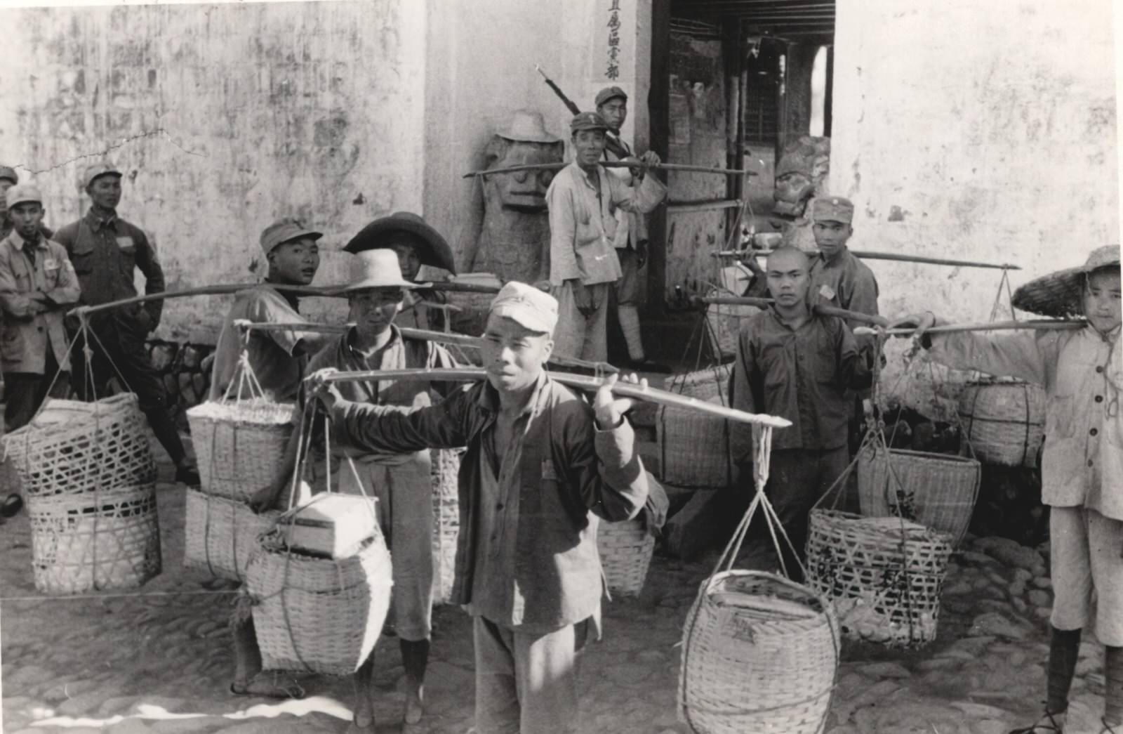 Soldiers and civilians come to a Field Hospital at Lihwang (Lihuang), Anhwei (Anhui), bearing gifts from civilians for the Army sick and wounded. 1937-1940