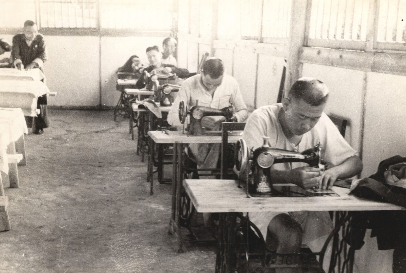 Disabled, crippled Chinese soldiers, from cooperatives of various kinds. These are trainees as tailors and have their own cooperative tailoring establishment. 1937-1940