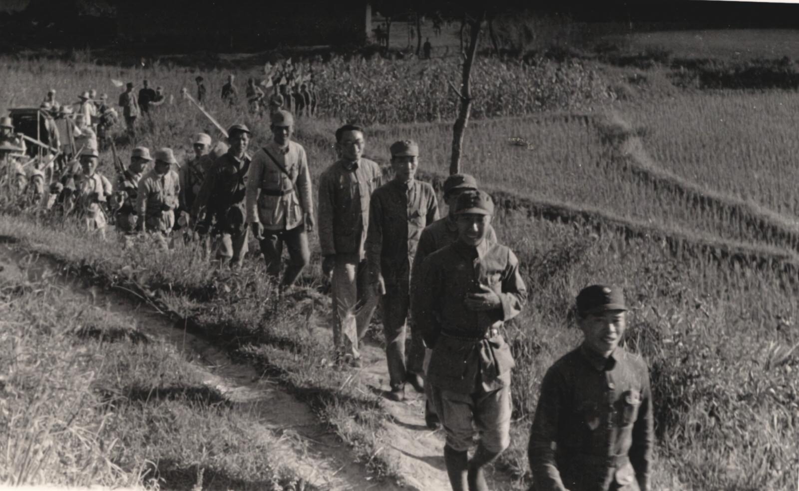Various civilian and military persons.
