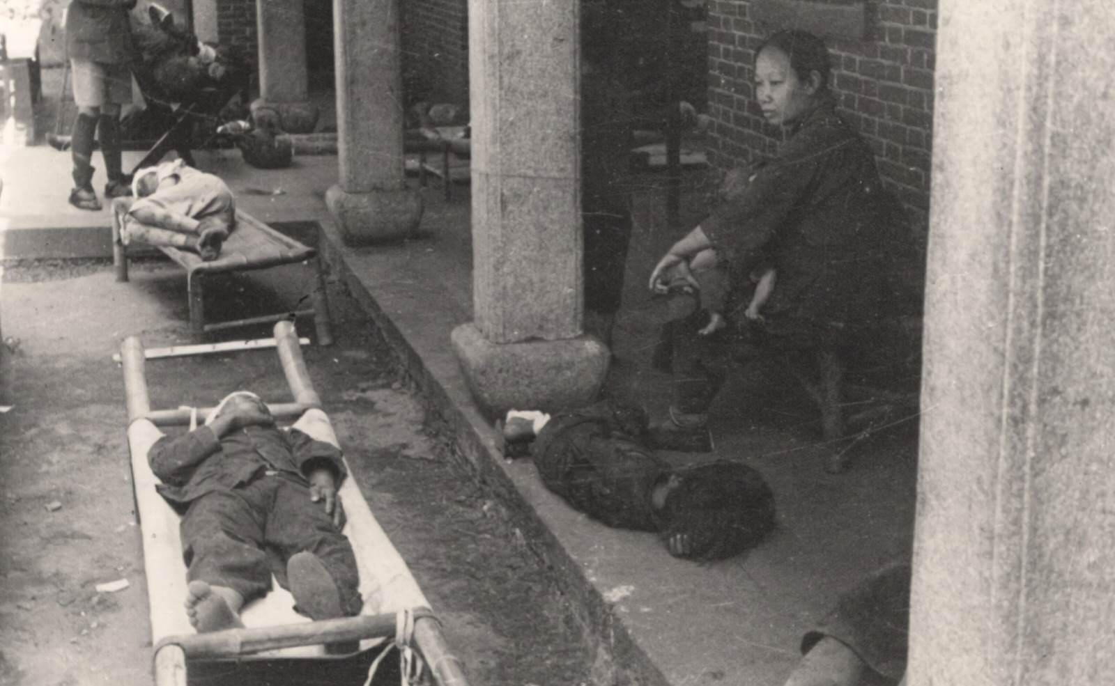 Air-raid victims were brought into Chinese Red Cross Medical Corps Headquarters in Changsha.