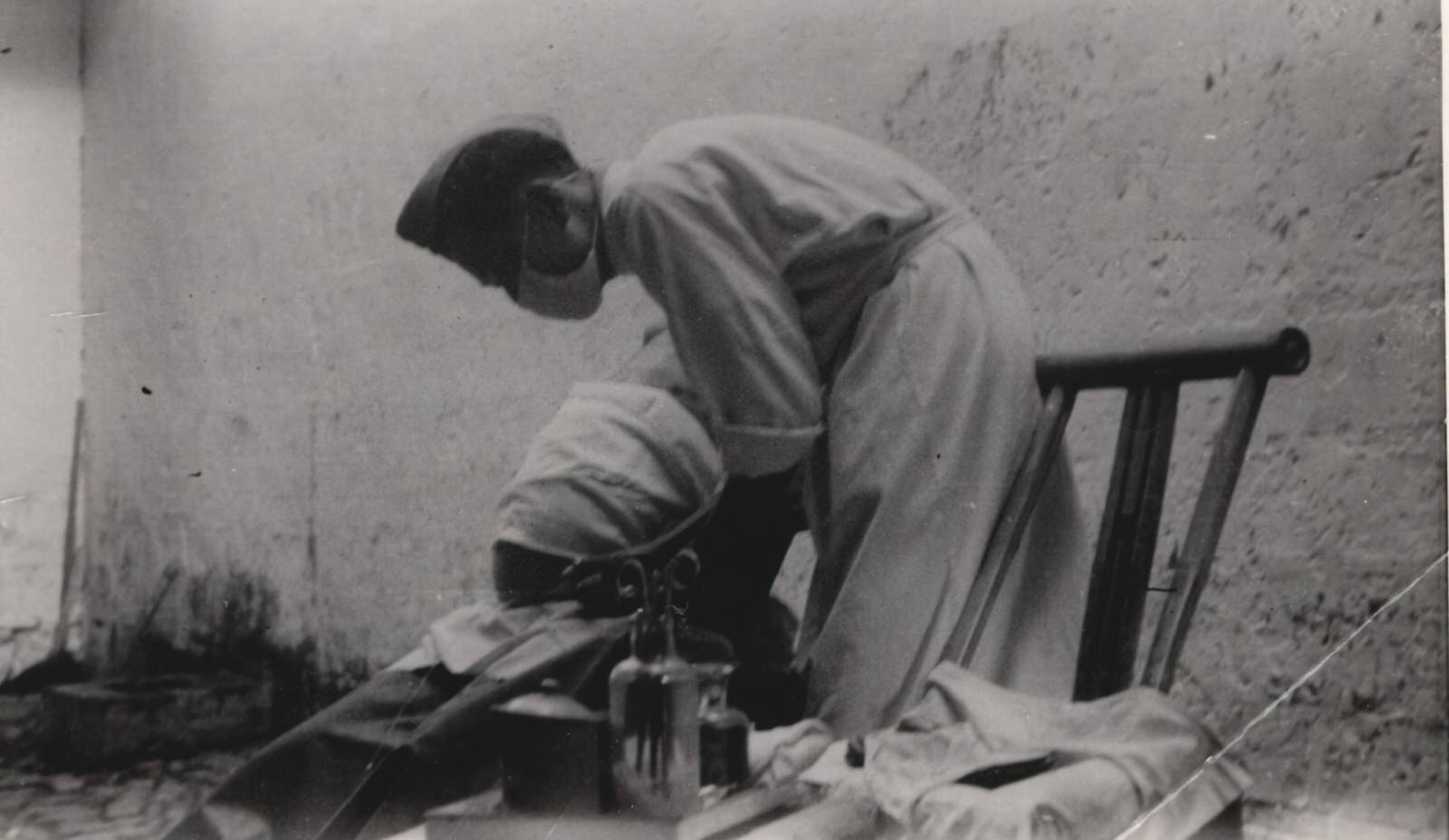 A KMT military medical officer having a surgery for the wounded. 1937-1940
