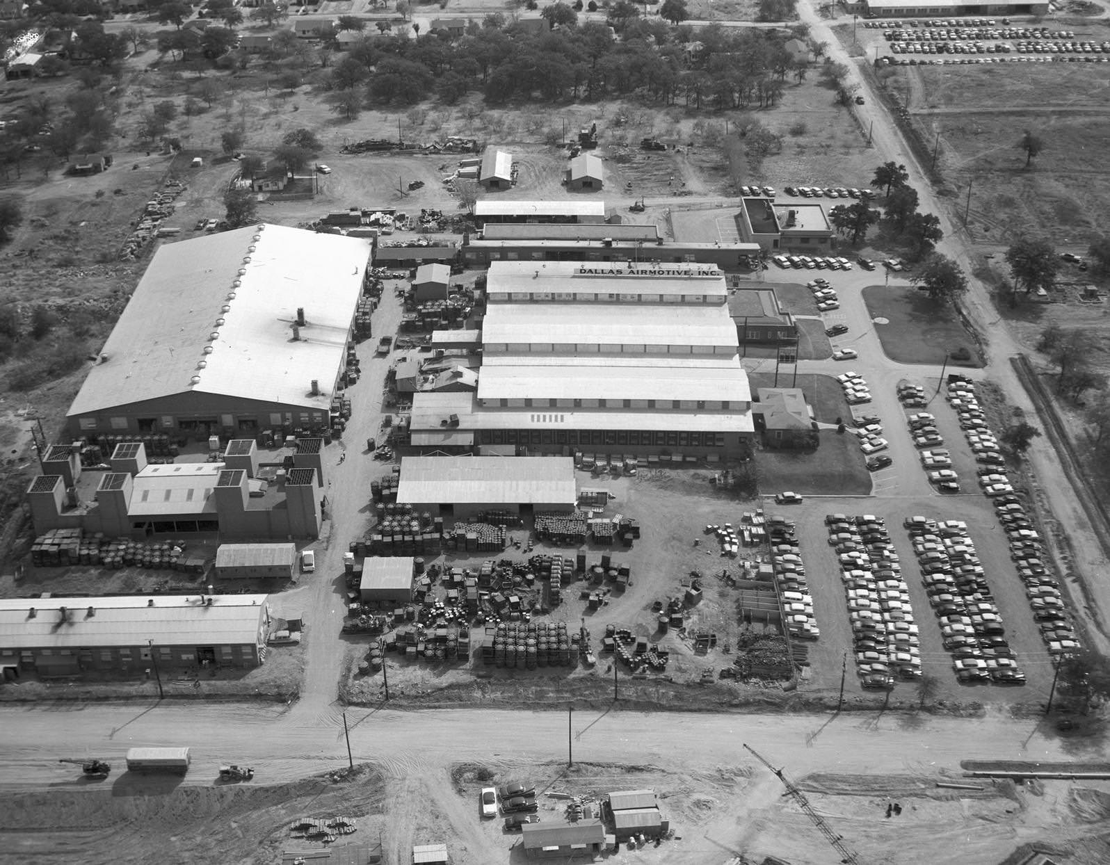 Aerial view of Dallas Airmotive, Incorporated factory and its parking lot, 1956