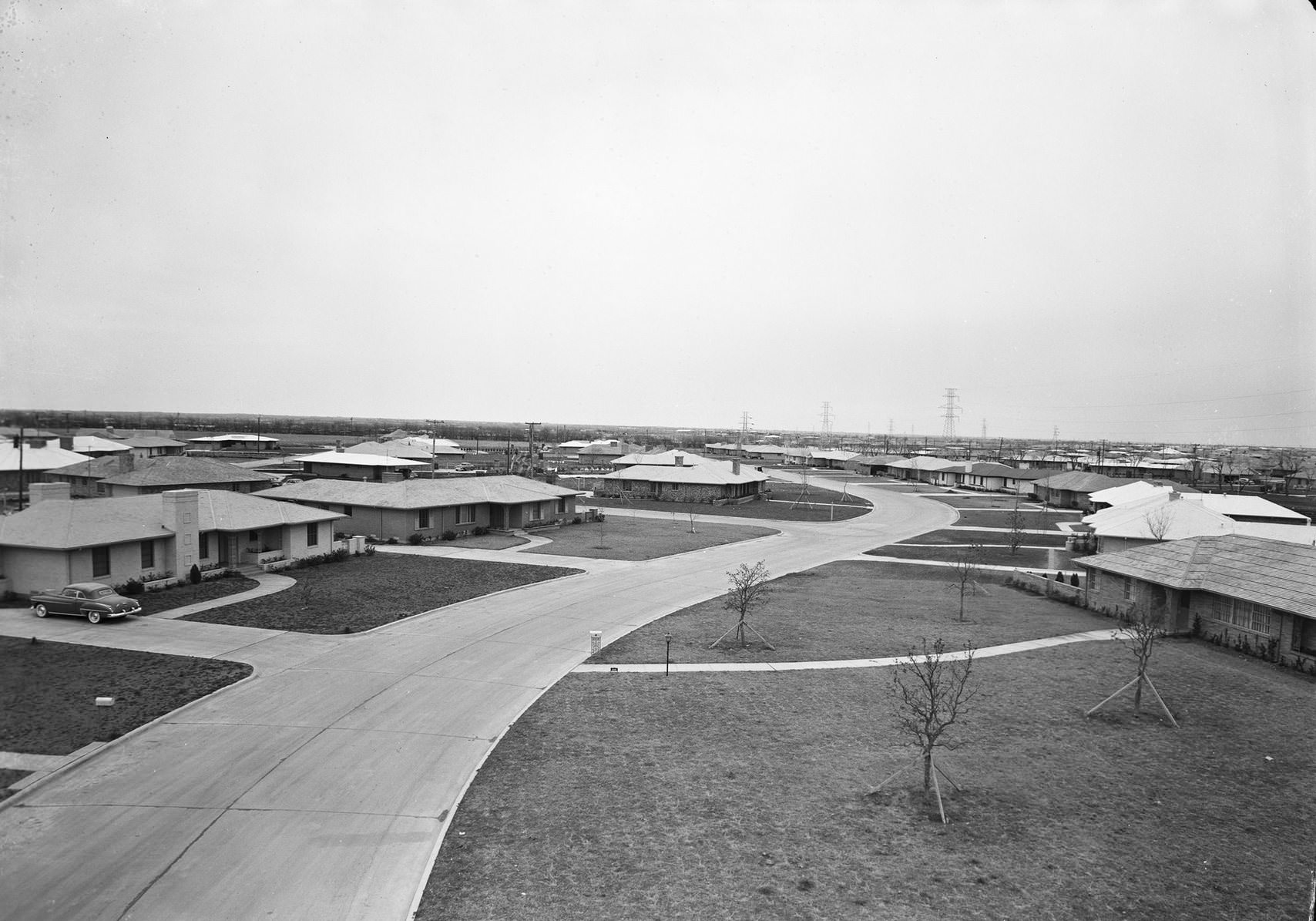 Ranch style homes, residential street, possibly Wynnewood subdivision, Oak Cliff area, Dallas, Texas, 1954