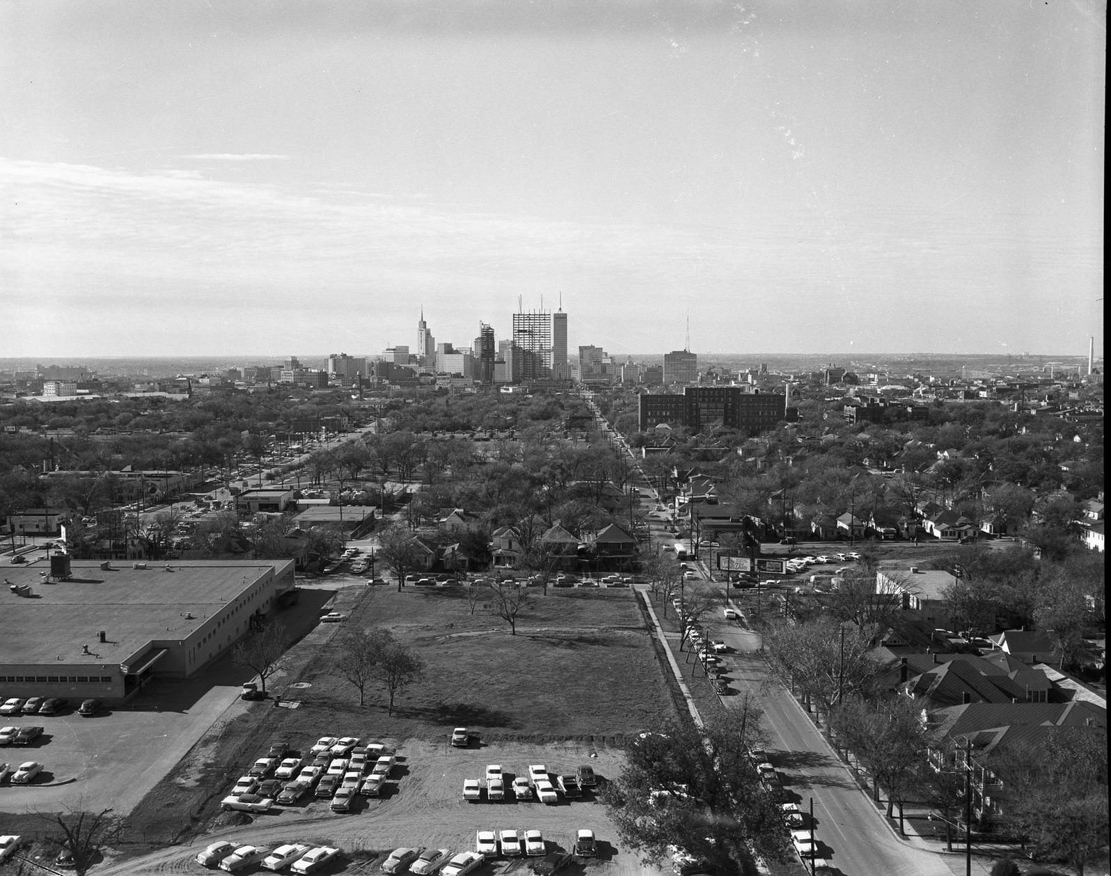 Aerial view of the Southland Center under construction, downtown Dallas, Texas, 1957