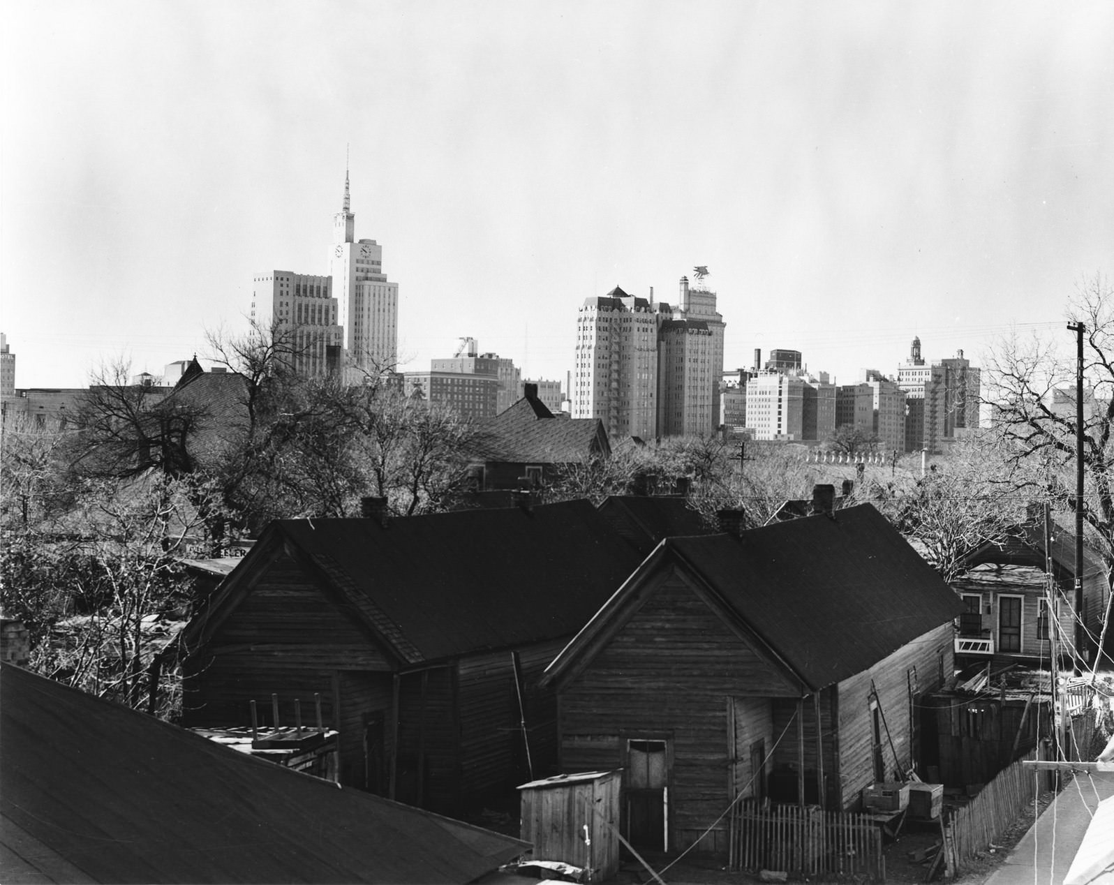 Skyline of downtown Dallas, Texas from the backyards of tenement houses, 1950