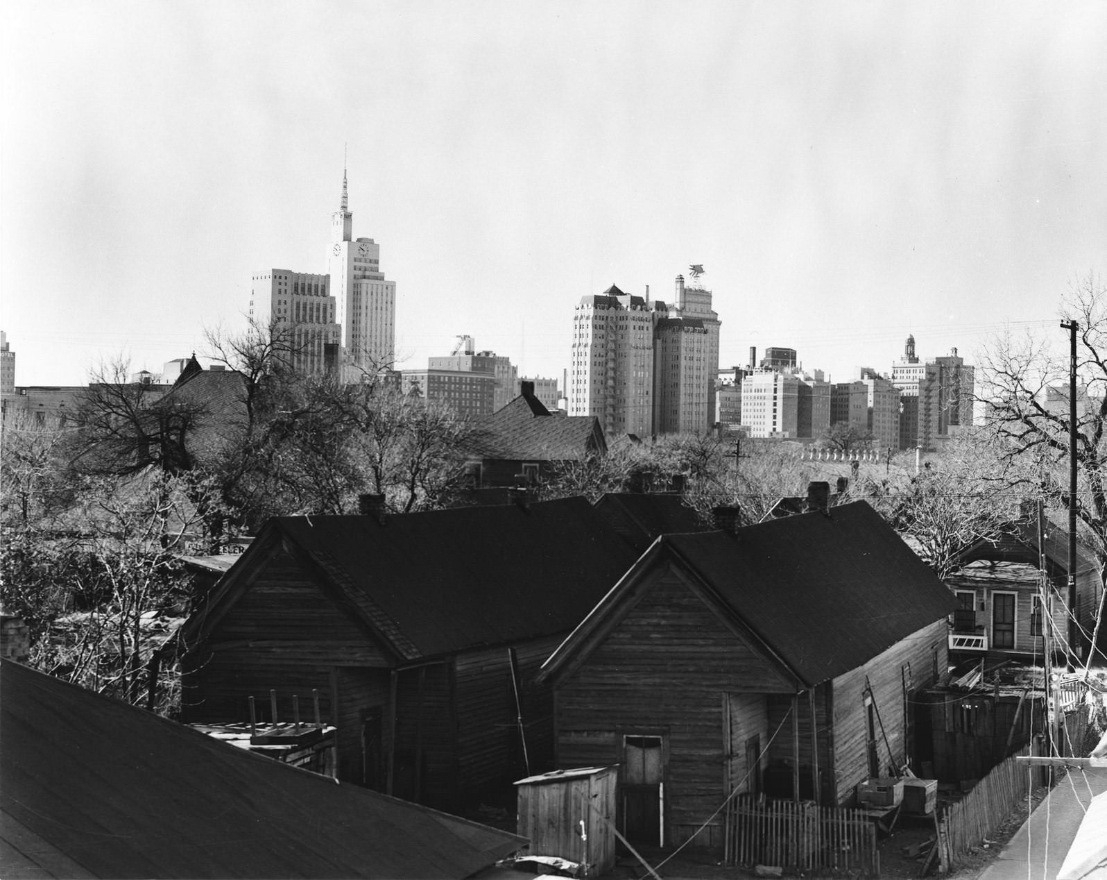 Skyline of downtown Dallas, Texas from the backyards of tenement houses, 1950