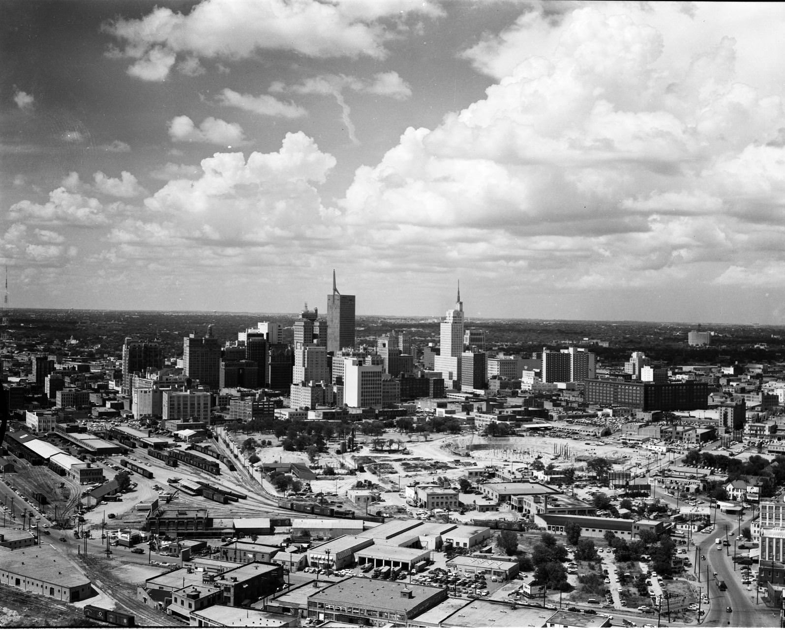 Skyline view of downtown Dallas, Texas looking north from the southside, showing a railroad yard in the foreground, 1955