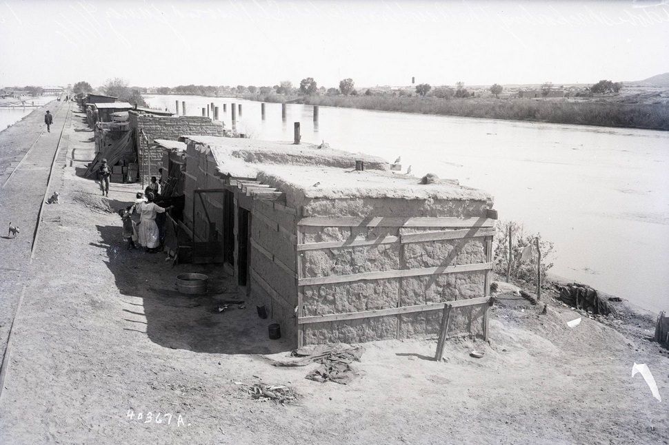 View of El Paso, looking North from International Bridge showing Mexican quarters, 1909