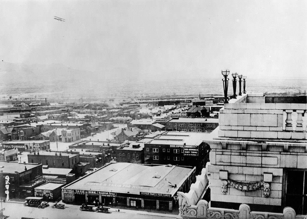 An airplane over the city, El Paso, 1900s