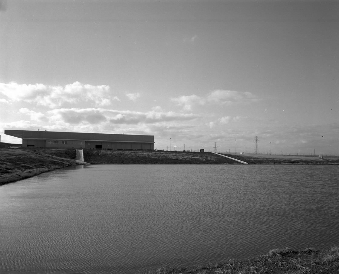 Carling Brewery, Fort Worth, Texas exterior of building with pond in foreground, 1965