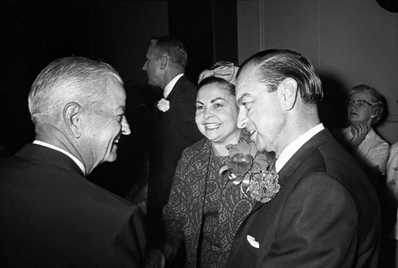 Arlington Mayor Tom J. Vandergriff and his wife, Anna, conversing with an attendee of an appreciation dinner held in Vandergriff's honor in Hotel Texas' Grand Ballroom, 1966