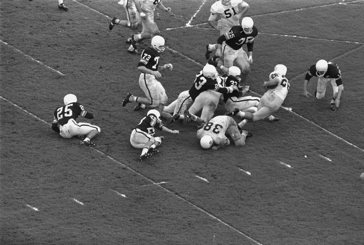 Larry Bulaich, Texas Christian University (T. C. U.) #26, drives for touchdown, 1962