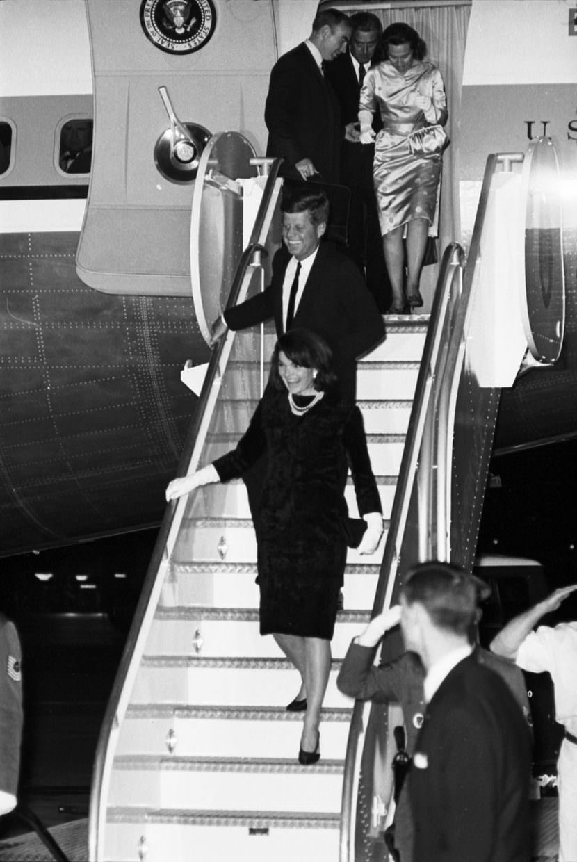 President John F. Kennedy and Jackie Kennedy descending from Air Force One. Congressman Jim Wright, Governor John Connally, and Mrs. Connally seen in doorway, Carswell Air Force Base, Fort Worth, 1963