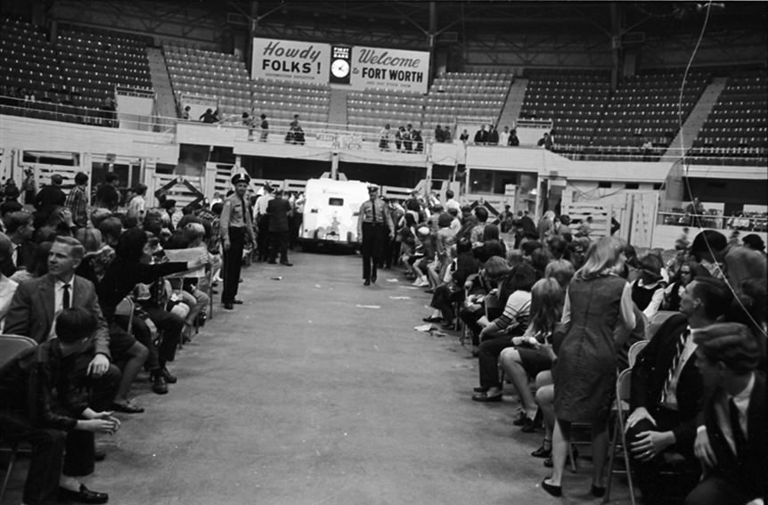 Rolling Stones rock group arrives in armored car inside Will Rogers Coliseum for a concert in Fort Worth, Texas, 1960s