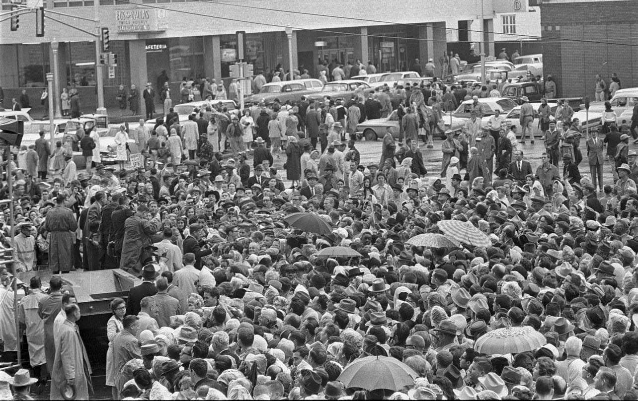 Overhead view of large crowd outside Hotel Texas, 1963