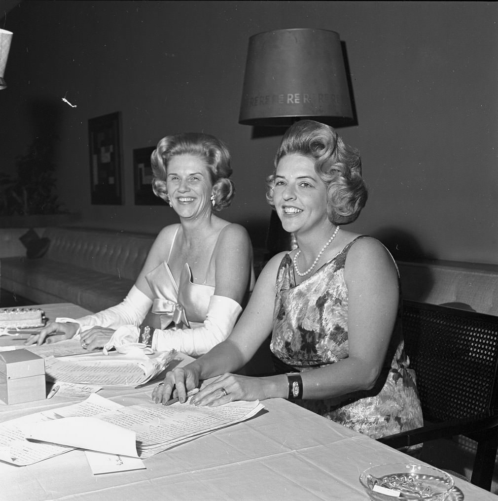 Mrs. W. K. Gordon Jr. with Mrs. James M. Harrison taking tickets at The Assembly Ball, Ridglea Country Club, Fort Worth, 1961