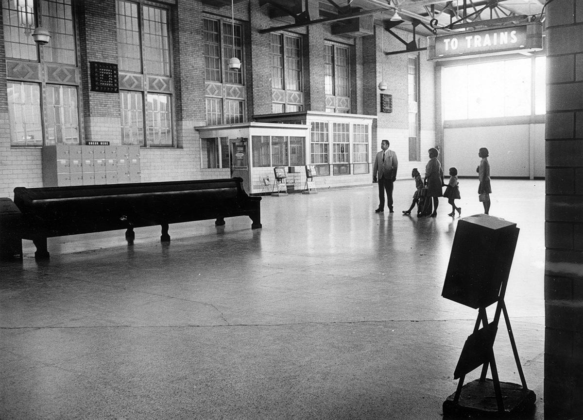 Mr. and Mrs. B. T. Balcom and daughters on their way to board a train, 1969