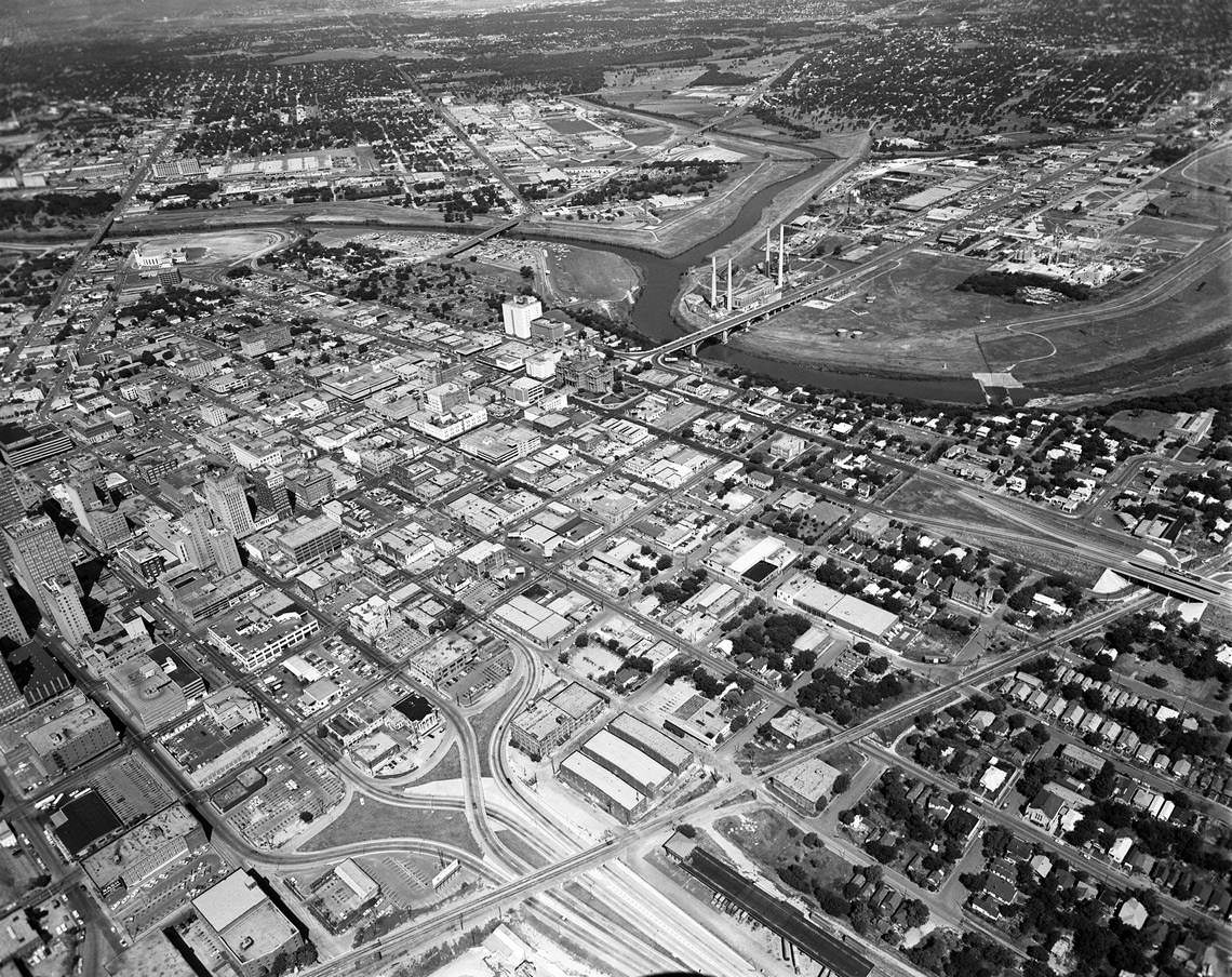 Aerial of downtown Fort Worth, Texas showing Jones Street, Spur 280 (4th Street access), 35W, Hwy. 121; Santa Fe railroad tracks on eastside near bottom right, 1967