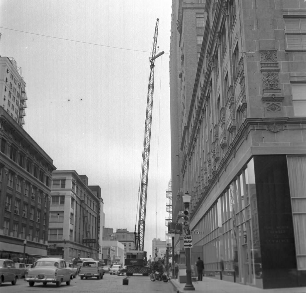 Fort Worth Club remodeling, rugs being lifted to 12th floor, 1960