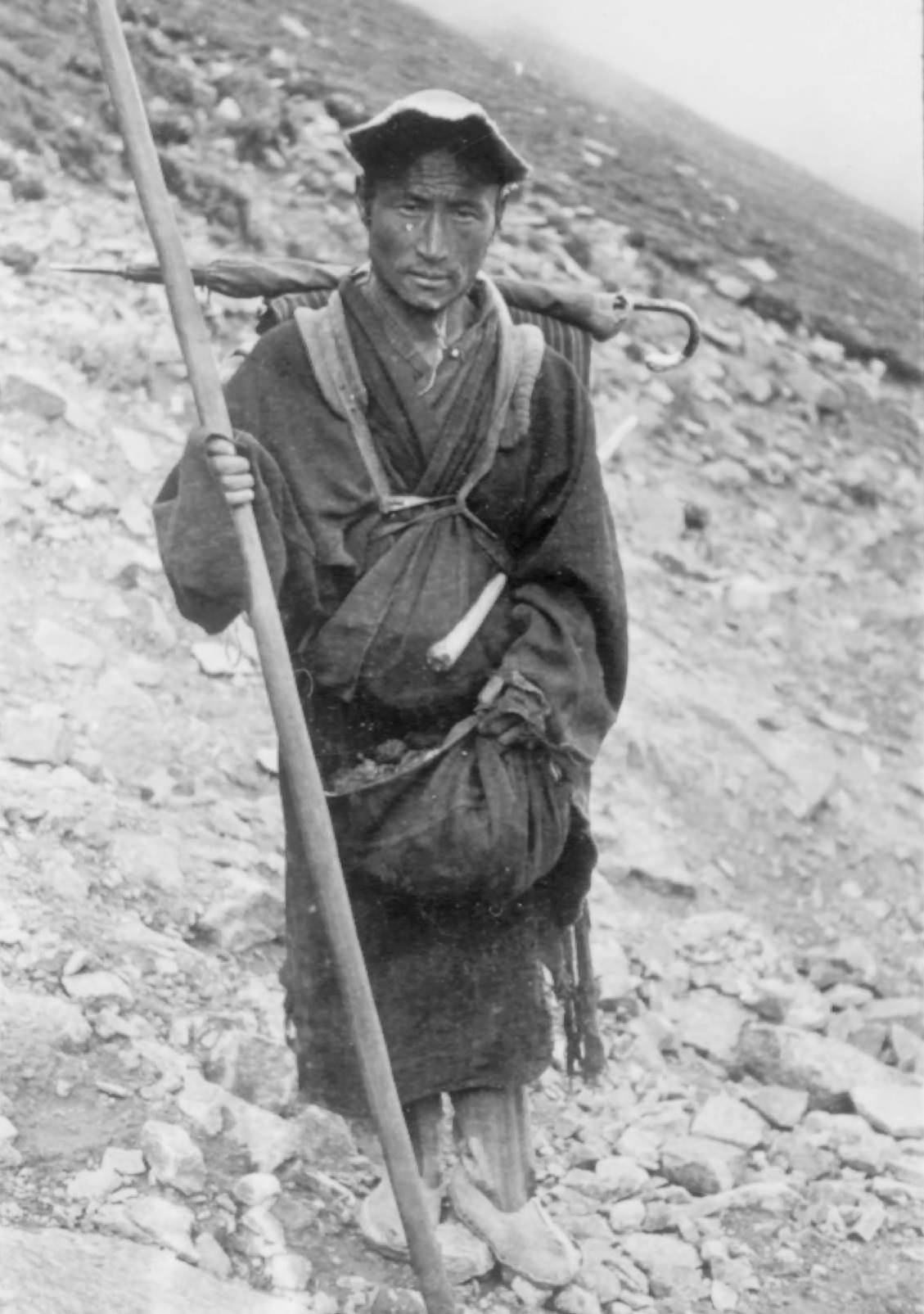 A Tibetan Monk, 1944. A Tibetan monk on pilgrimage. He carries a spear.