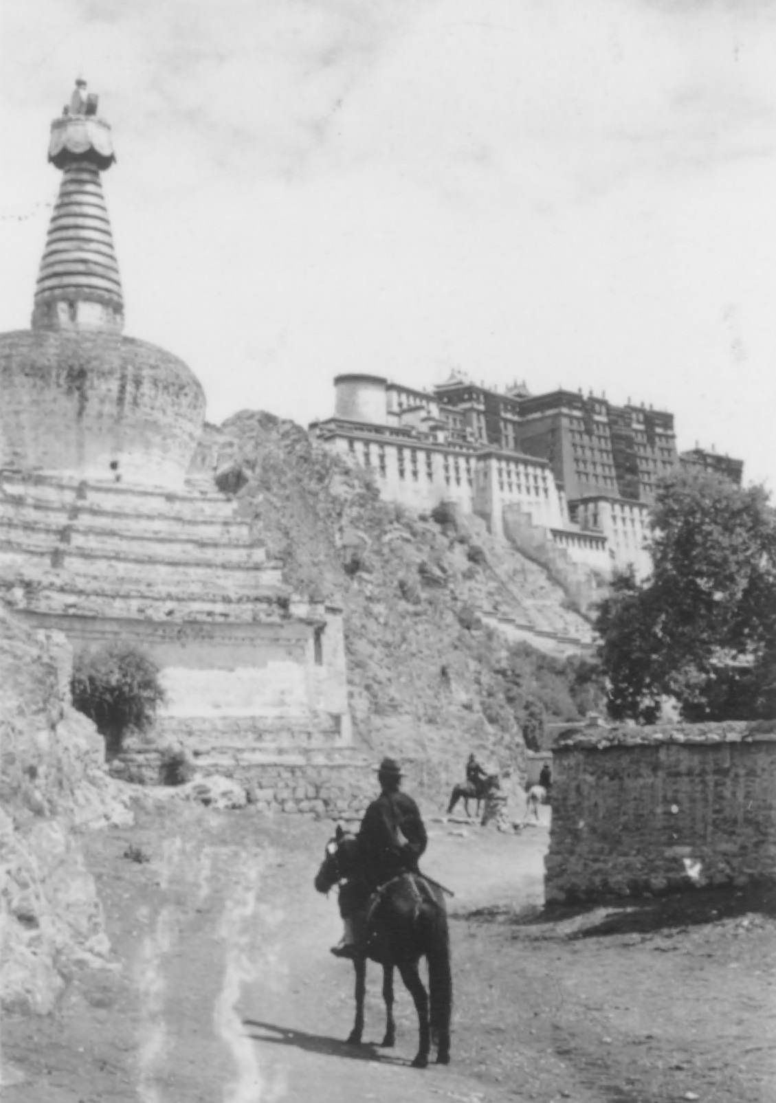 Buddhist Monument, Chorten, 1944. Buddhist monument, chorten, with Potala in the background.