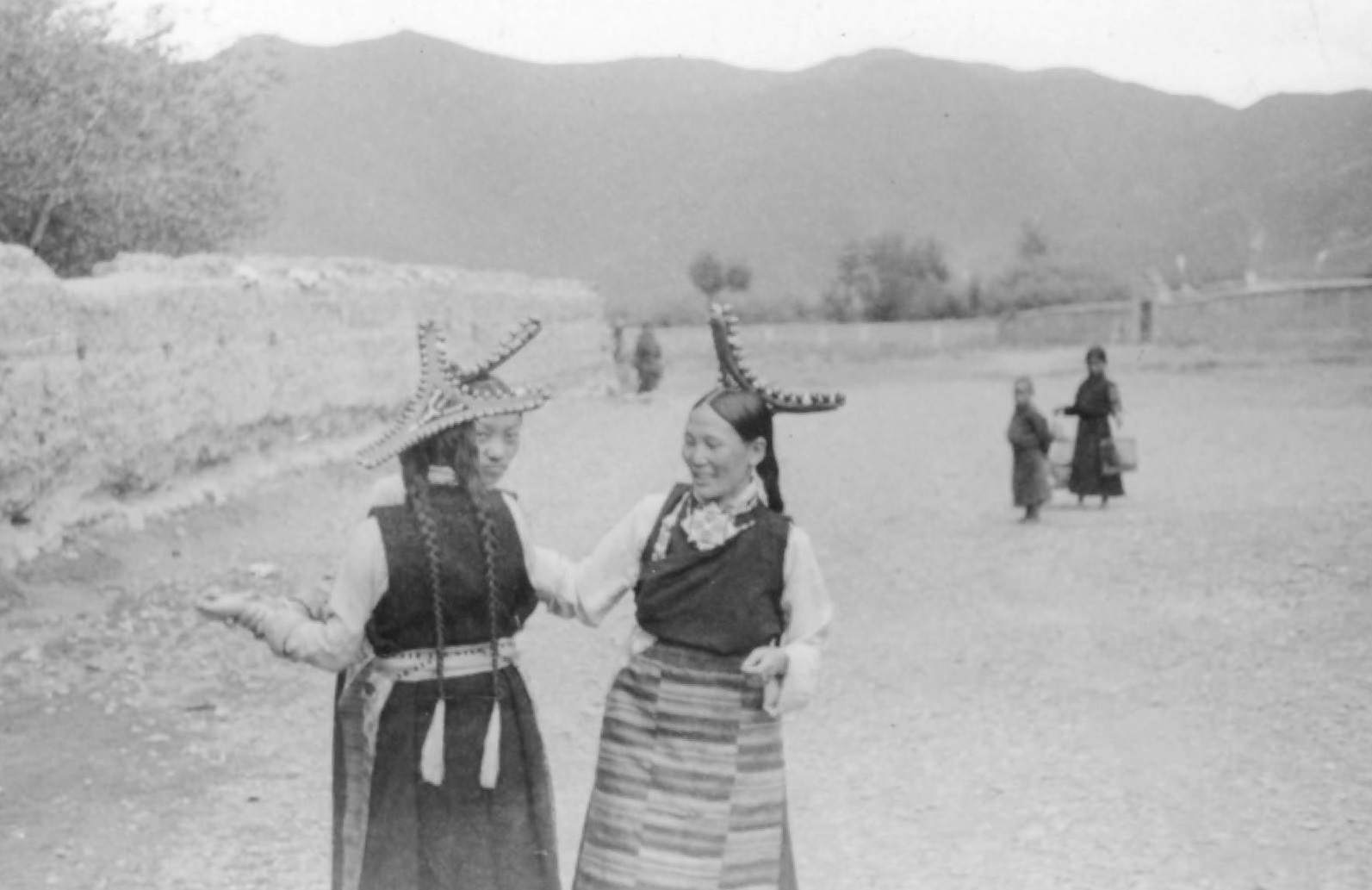 Tibetan Women Gossip in the Road, Outside Lhasa, 1944