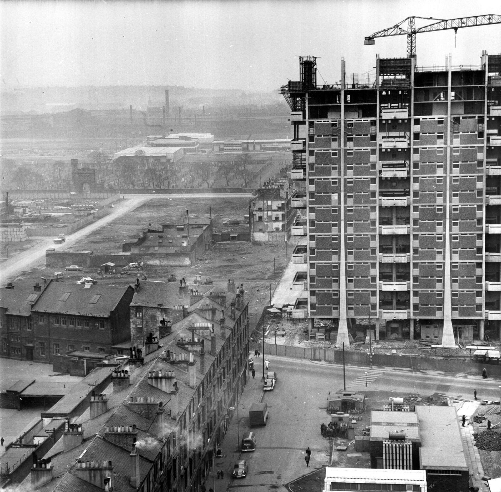 Modern housing under construction beside old tenements in the Gorbals area of Glasgow, 1960