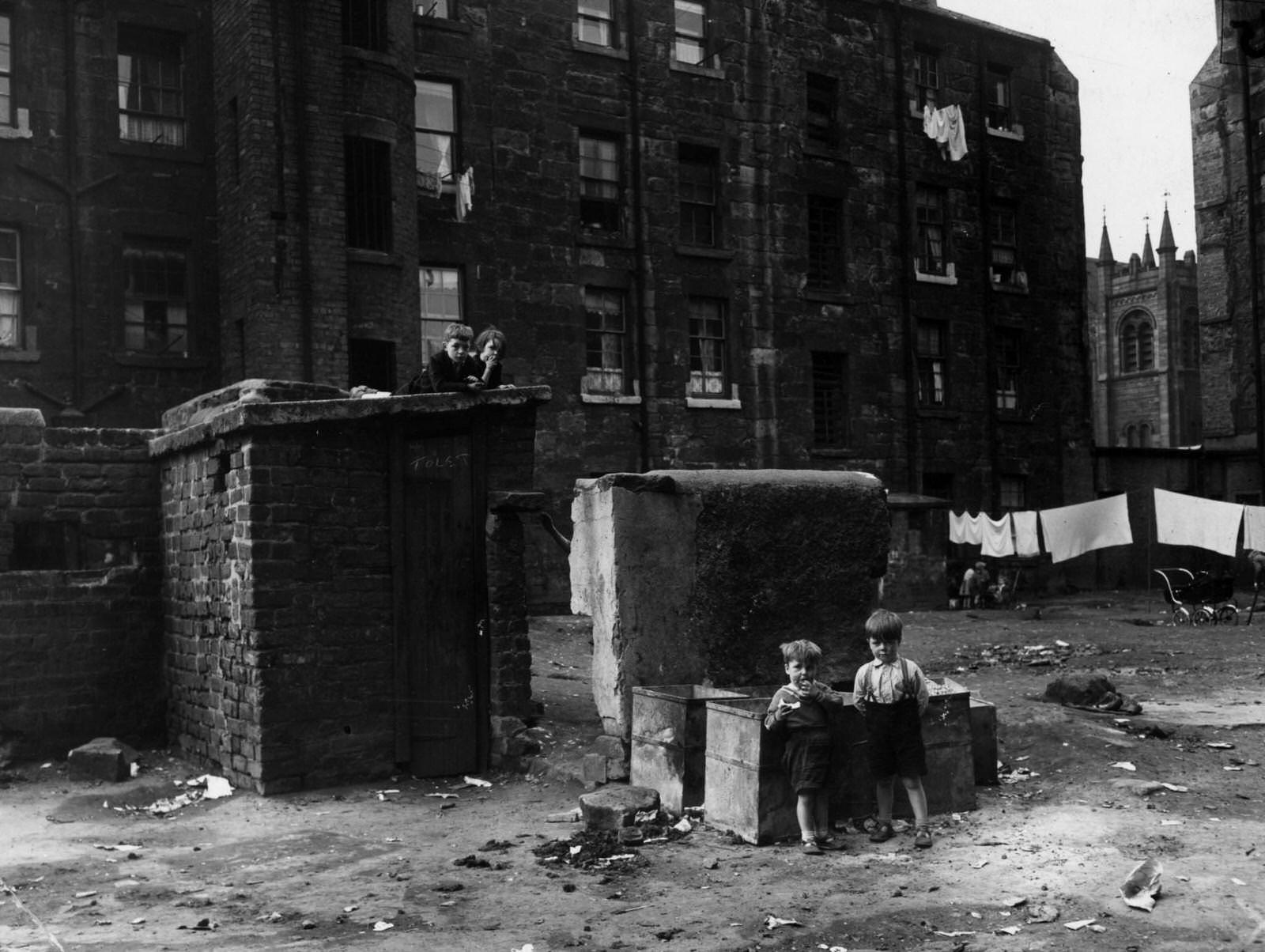 Children playing in a Glasgow slum which is to be demolished, 1956
