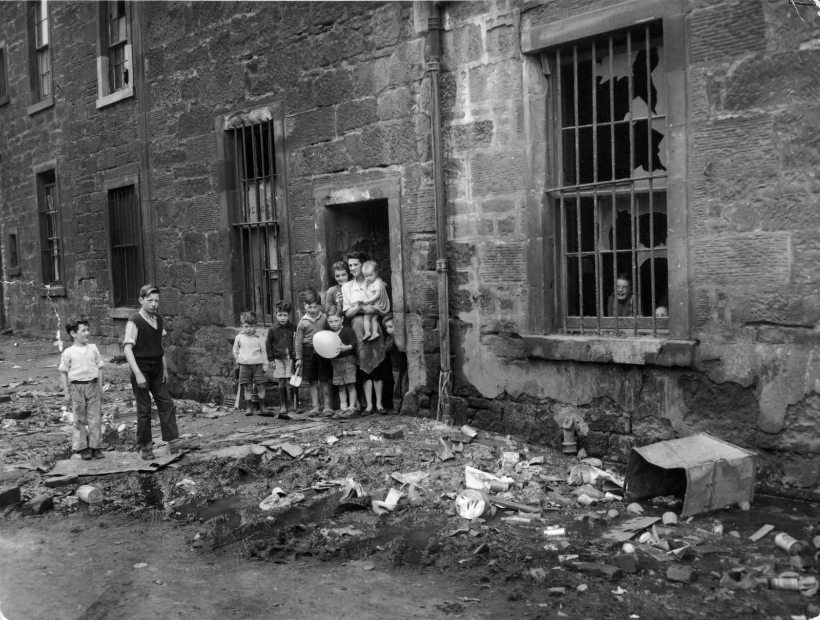 The Surrey Lane entrance to Nicholson Street flats, in the Gorbals, the notorious slum district of Glasgow, 1956
