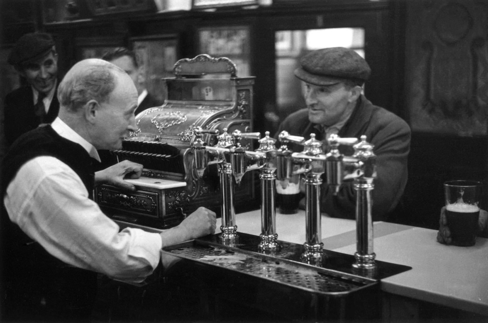A barman at work in the Gorbals district of Glasgow, 1948