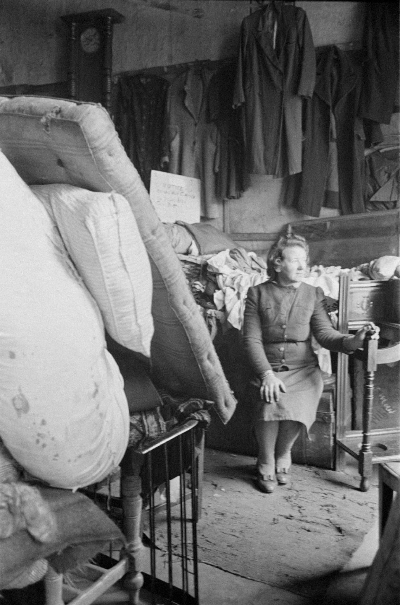 Mrs Lundy at her junk shop in Bedford Street in the Gorbals, a slum district of Glasgow, 1948.