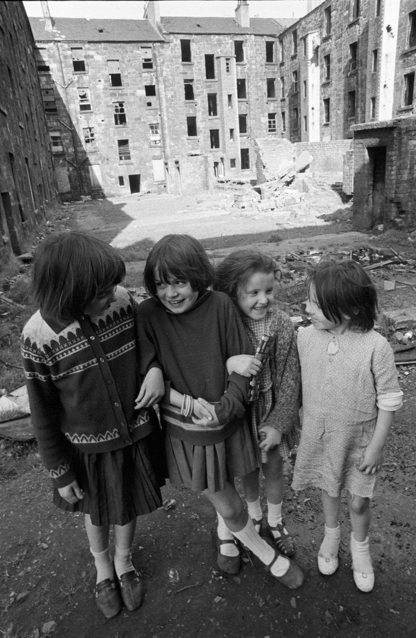 Four little girls posing in front of slum housing in the notorious Gorbals district of Glasgow in 1969.