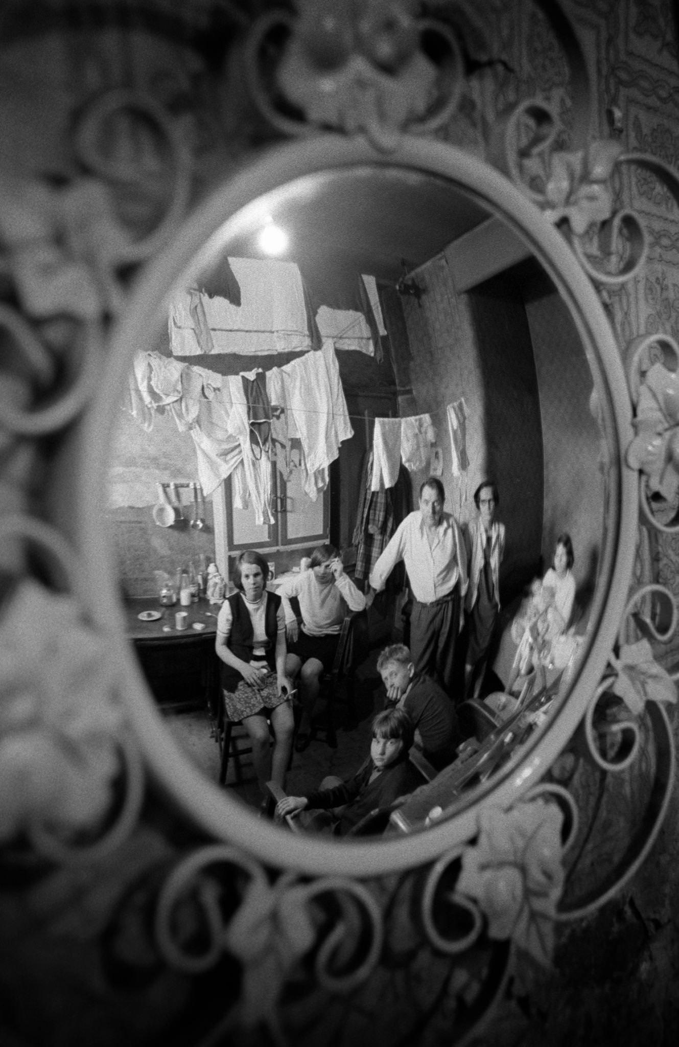 A family of eight reflected in a mirror in their home in the notorious Gorbals district of Glasgow in 1969.