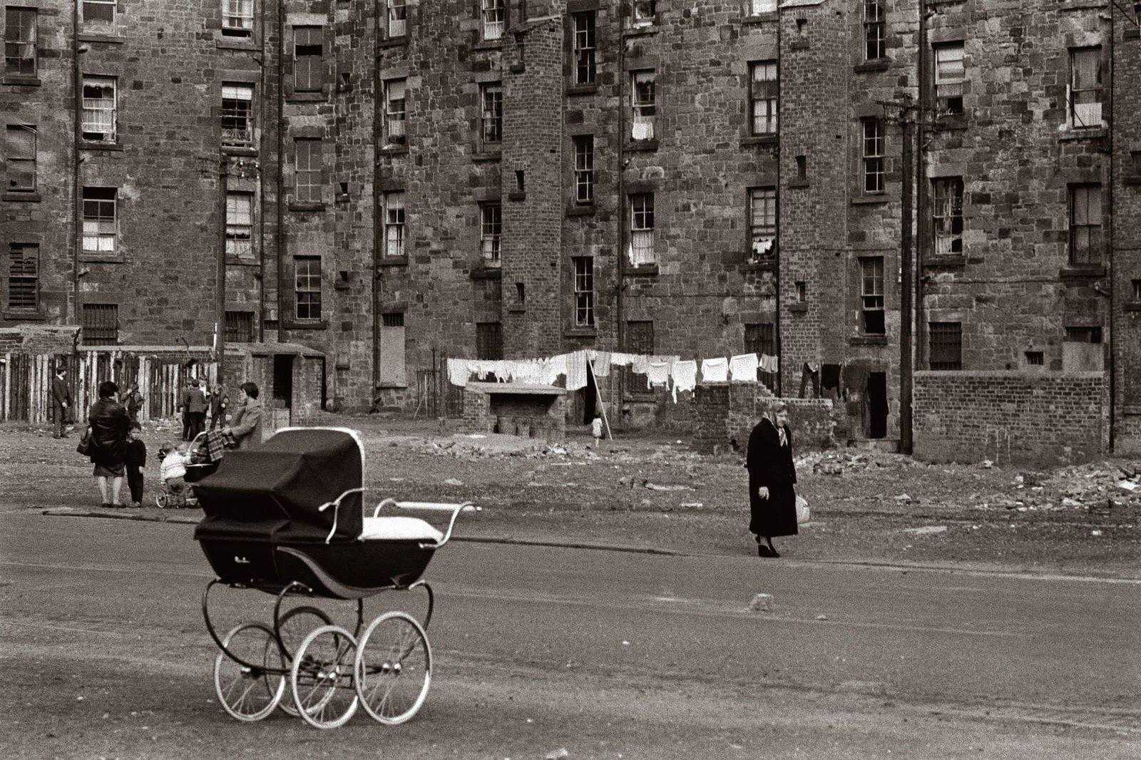 A lone pram beside a road in the Gorbals area of Glasgow, 1968.