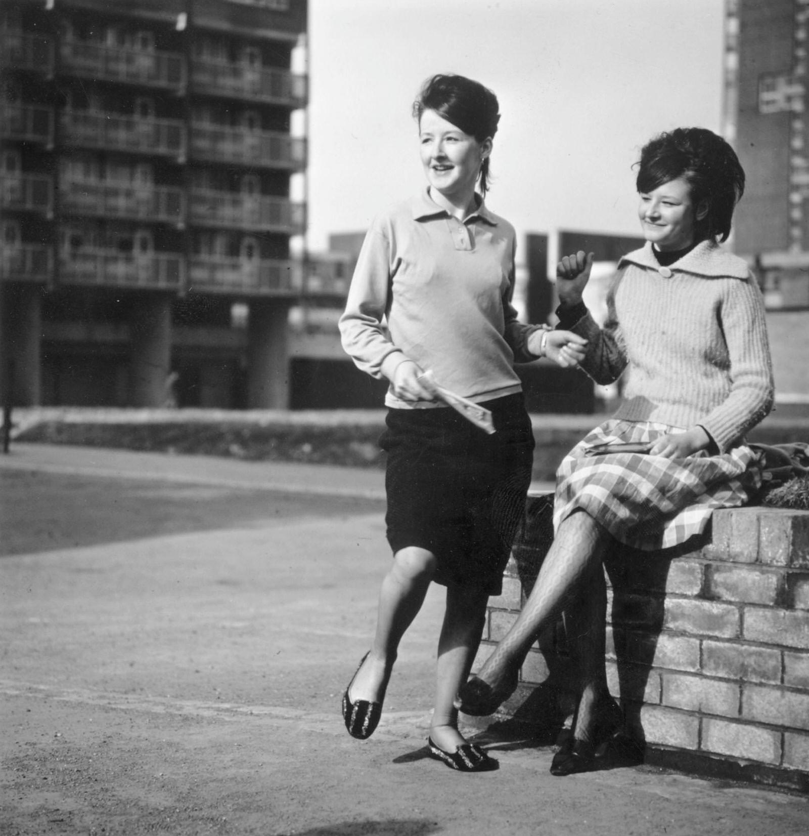 Beatles fan Ann and her sister Eileen dance the twist in a housing estate in the Gorbals area of Glasgow, 1966