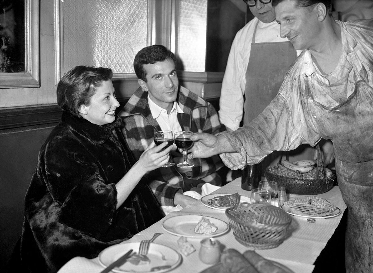 French dancer Zizi Jeanmaire, accompanied by her husband in Les Halles, 1952