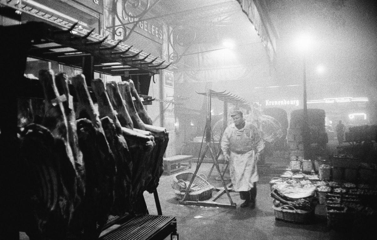 Butcher at work in Les Halles which was the central wholesale market of Paris, 1950