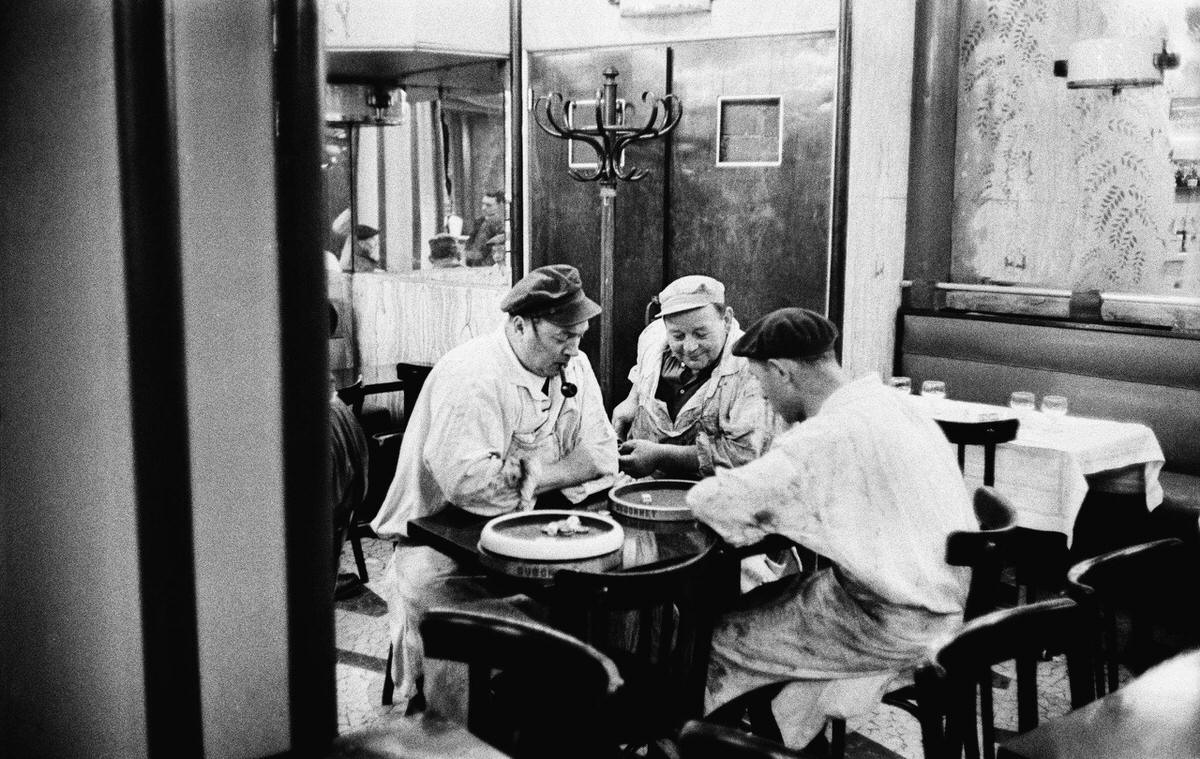 Butchers playing dice in a cafe in Les Halles district, 1950