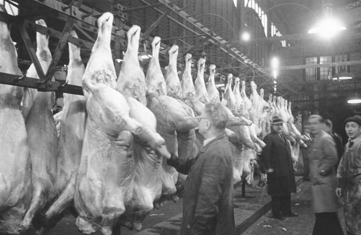Carcasses of animals hanging up in a meat market at Les Halles, Paris, 1947